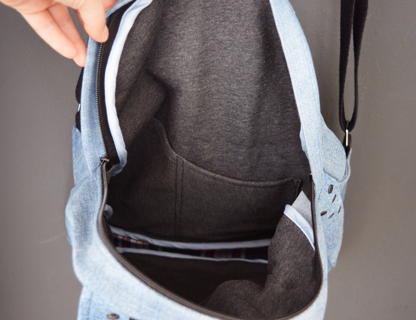 Denim backpack with black studs and lots of pockets
